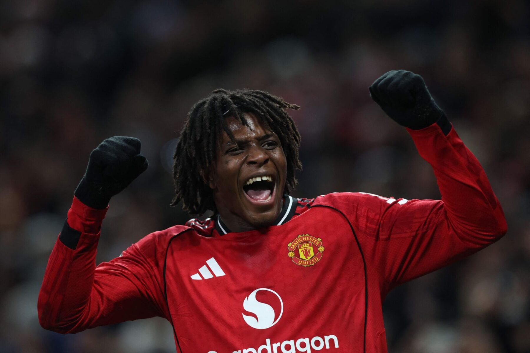 Manchester United's Danish defender #13 Patrick Dorgu celebrates after scoring the opening goal of the English Premier League football match between Manchester United and Newcastle United at Old Trafford in Manchester, north west England, on December 26, 2025. (Photo by Darren Staples / AFP)